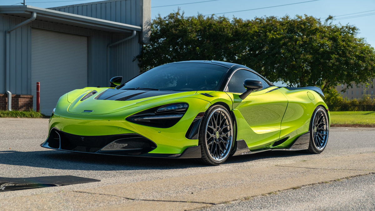 Green McLaren 720S with Strasse wheels and a custom carbon-fiber body kit in a full front three-quarter view